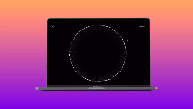 Macbook auf vertikalem Farbverlauf von Orange nach Violett. Bildschirm zeigt einen Kreis aus hunderten weißen Flecken.